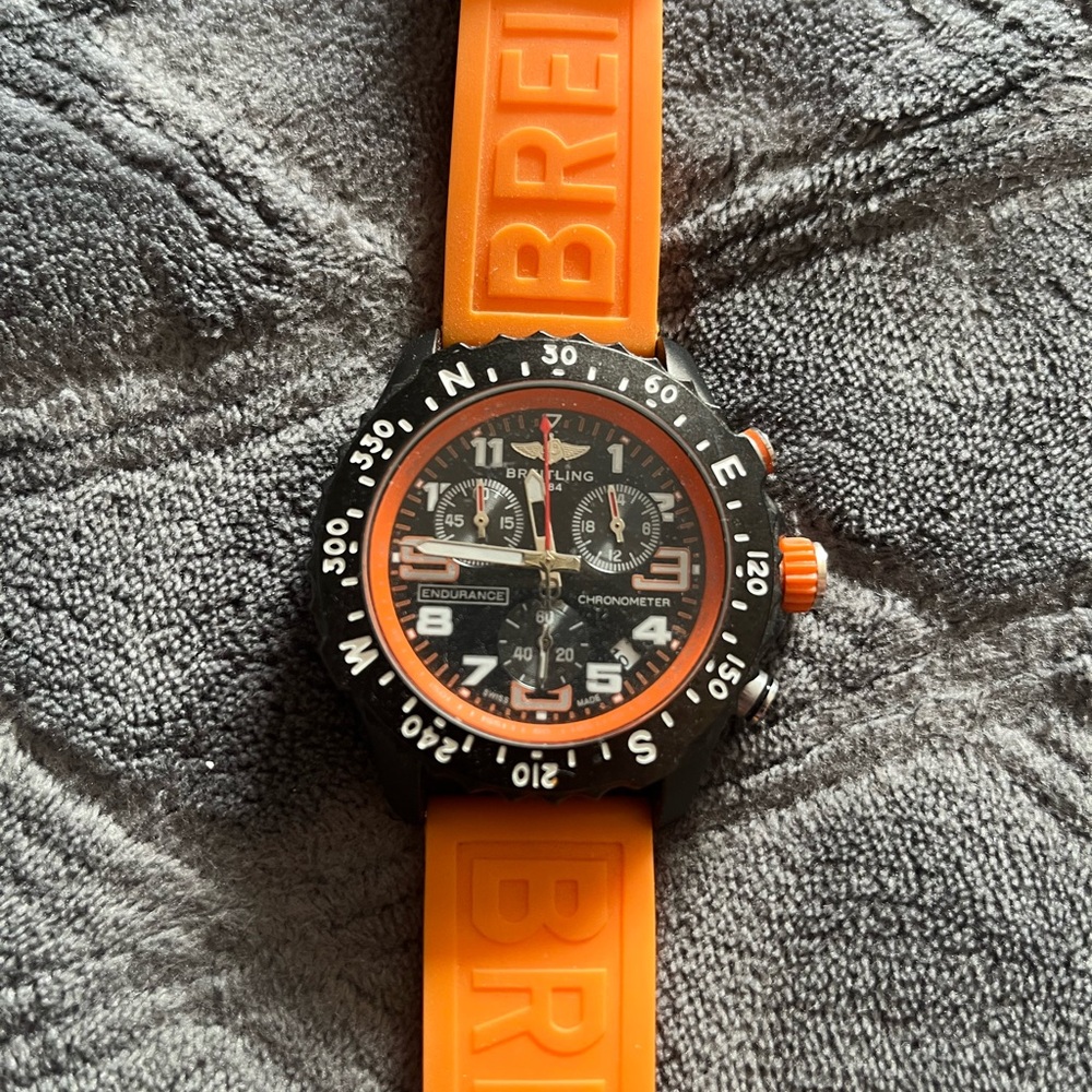 Breitling Men's Watch with Orange Strap and Black Dial
